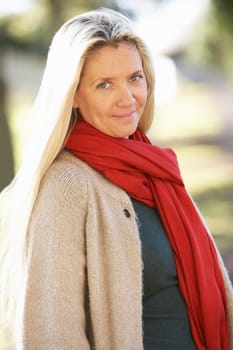 Portrait Of Woman Outdoors In Autumn Landscape
