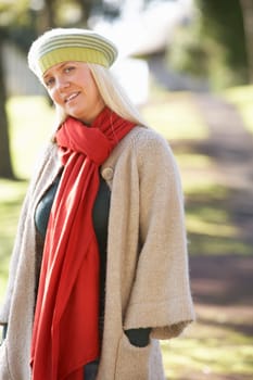 Portrait Of Woman Outdoors In Autumn Landscape