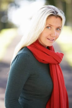 Portrait Of Woman Outdoors In Autumn Landscape