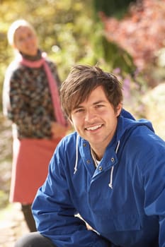 Portrait Of Romantic Young Couple In Autumn Park