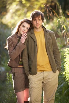 Portrait Of Romantic Young Couple In Autumn Landscape