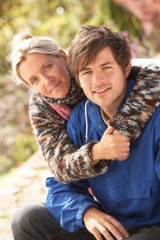 Portrait Of Romantic Young Couple In Autumn Park