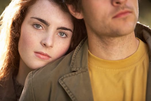 Portrait Of Romantic Young Couple In Autumn Landscape