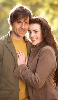 Portrait Of Romantic Young Couple In Autumn Landscape