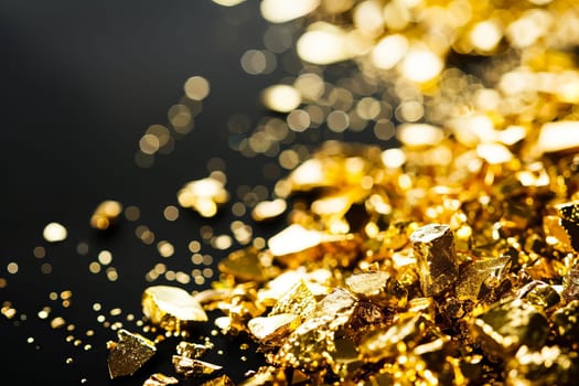 Shimmering gold nuggets with bokeh background.