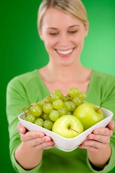 Healthy lifestyle - woman holding bowl with fruit