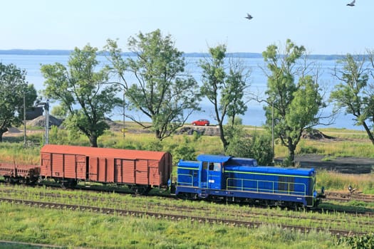 Landscape with the train and a lake