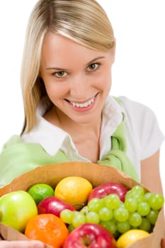 Healthy lifestyle - woman with fruit shopping paper bag