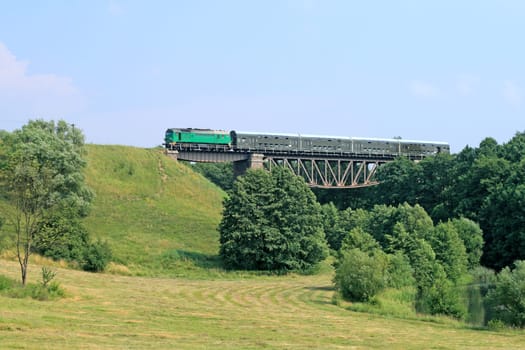 Passenger train passing the bridge