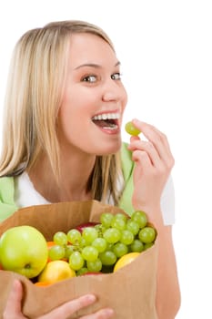 Healthy lifestyle - woman with fruit shopping paper bag