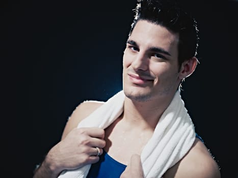 male athlete smiling and looking at camera
