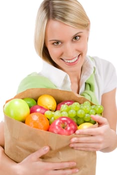 Healthy lifestyle - woman with fruit shopping paper bag