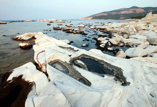 Blocks of marble in the sea on Aliki