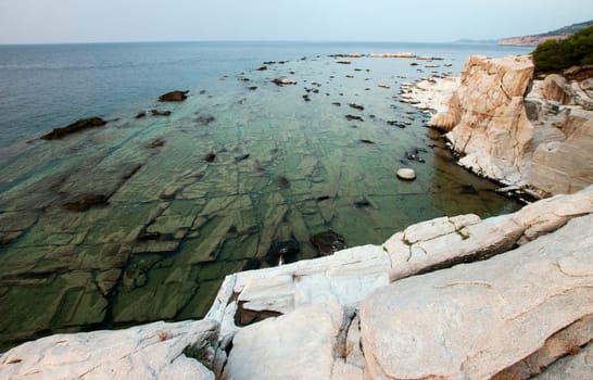 Blocks of marble in the sea on Aliki
