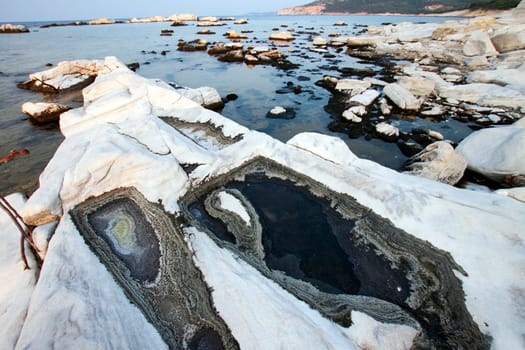 Blocks of marble in the sea on Aliki