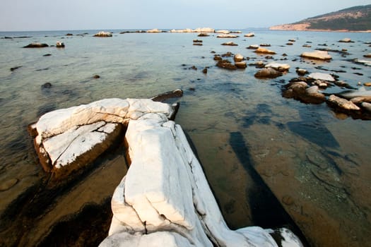 Blocks of marble in the sea on Aliki