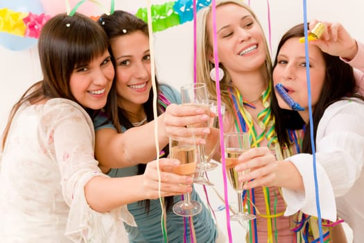 Birthday party celebration - four woman with confetti have fun