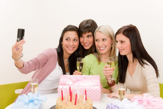 Birthday party - cheerful woman take photo with camera