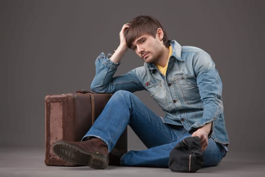 sad man with suitcase