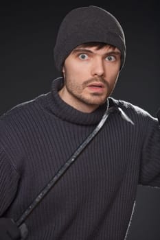 robber with crowbar