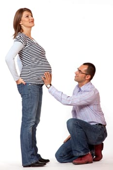 Happy young man and his pregnant wife