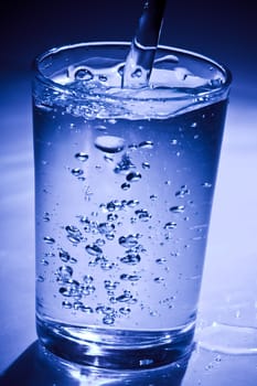 Glass of water with air bubbles