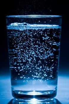 Glass of water with air bubbles