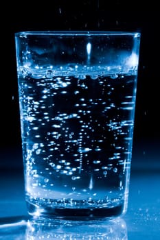 Glass of water with air bubbles