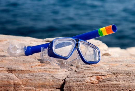 blue diving goggles with snorkel