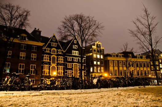 Amsterdam canals and typical houses on a snowy winters night