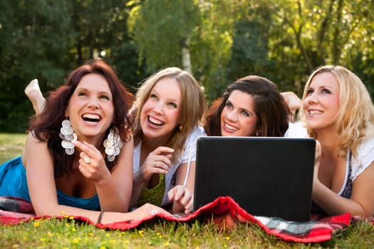 Girlfriends are having fun in the park