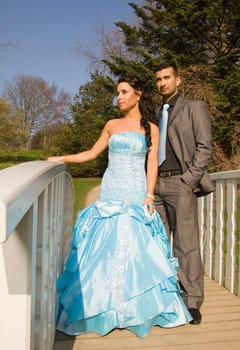 ethnic couple at engagement or wedding. young turkish people together in love with blue dress and suit