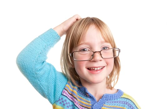child thinking with glasses scratching head wit hand contemplating.