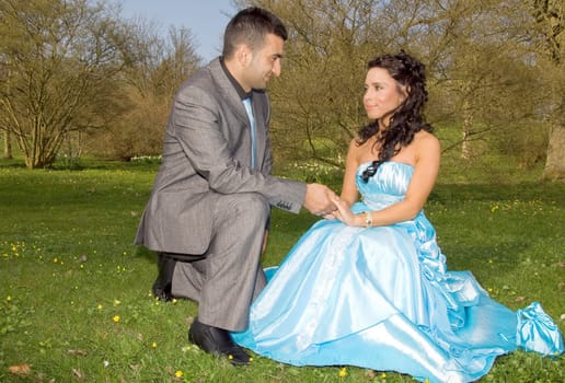 ethnic couple at engagement or wedding. young turkish people together in love with blue dress and suit