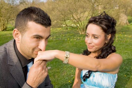 ethnic couple at engagement or wedding. young turkish people together in love with blue dress and suit