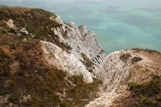 cliff coastline in england. chalk cliffs of beachy head part of seven sisters by the sea on foggy day