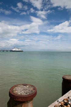 Easbourne pleasure pier in england. Uk holiday seaside resort in east sussex. sea and victorian architecture