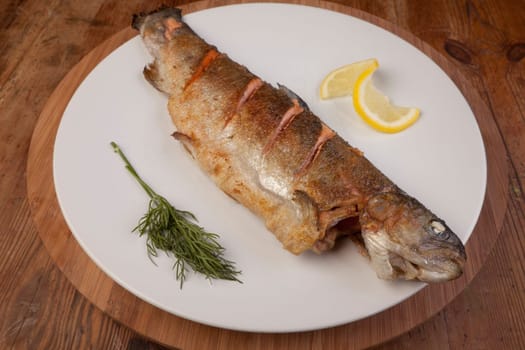 fish dinner of rainbow trout. fresh healthy meal on plate