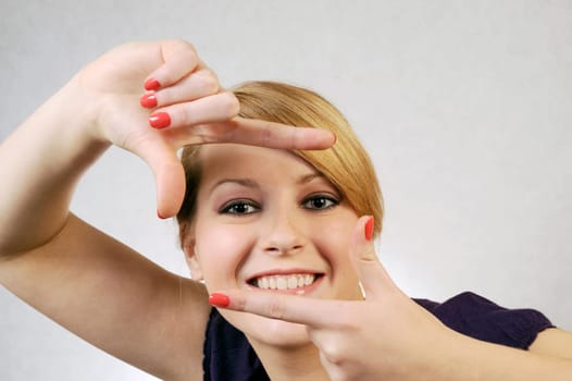 The young girl shows hands a cinema shot