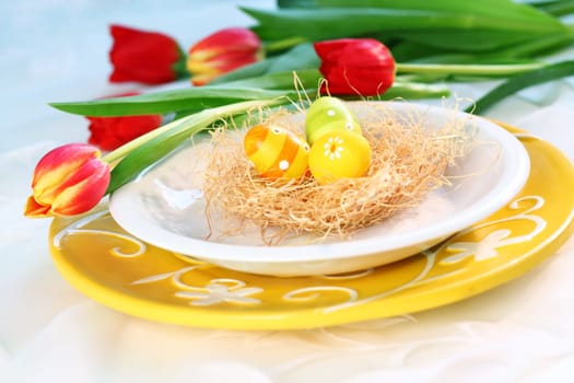 Easter eggs with tulips for spring table decoration