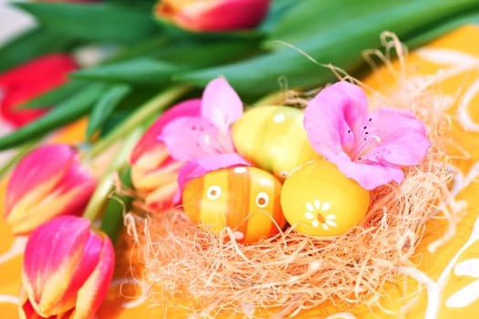 Easter eggs with tulips for spring table decoration