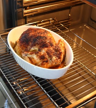 Baked chicken in open oven