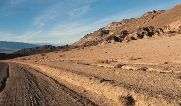 Artist&#039 s Drive rises up to the top of an alluvial fan fed by a deep canyon cut into the Black Mountains. Artist&#039 s Palette is on the face of the Black Mountains and is noted for having various colors of rock.
