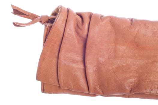 detail of a brown woman leather clutch isolated on white background