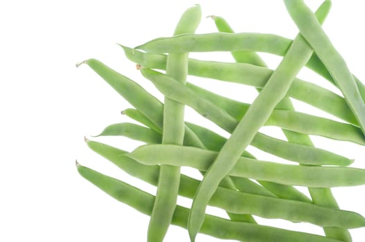 pile of fresh green french beans isolated white background