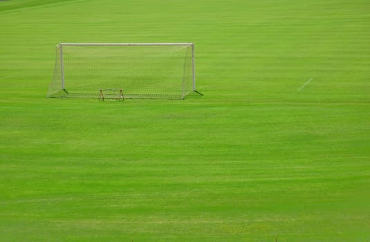 Detail shot of a goal in a football field.