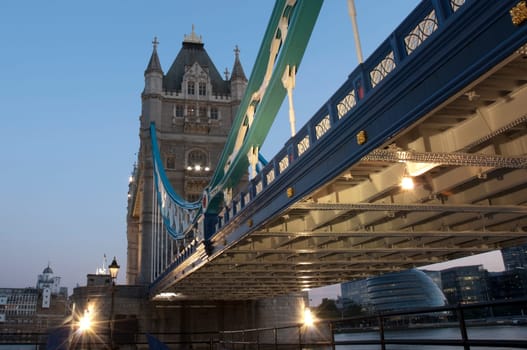 Low angle shot of Tower Bridge detail in London at dusk.