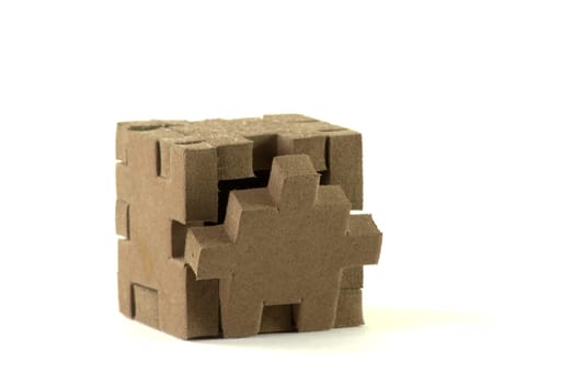 Foam material box with puzzle shaped sides.
