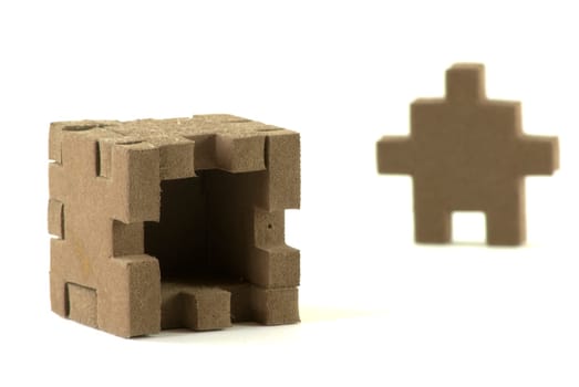 Foam material box with puzzle shaped sides.