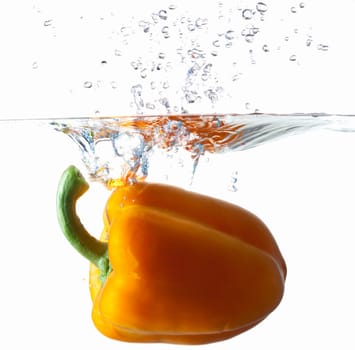 Orange Bell Pepper Dropping Into Water